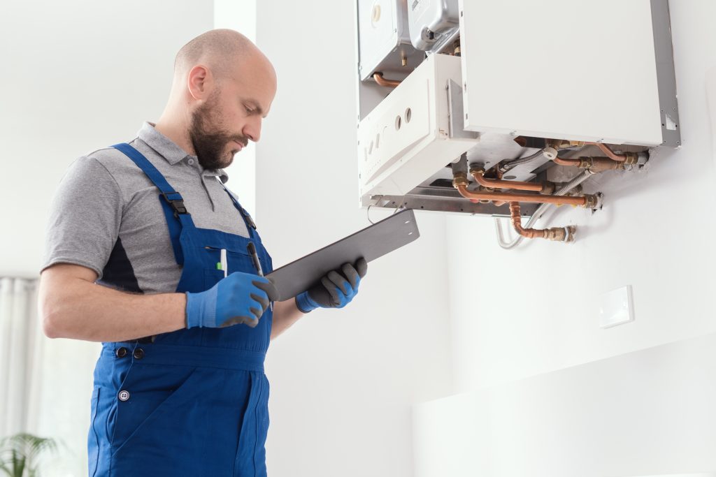 engineer fixing a boiler