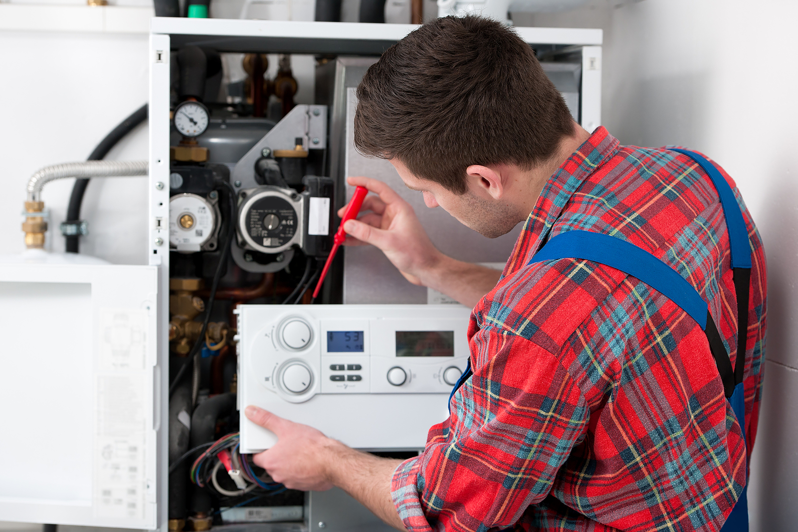 boiler service surbiton - Technician servicing the gas boiler